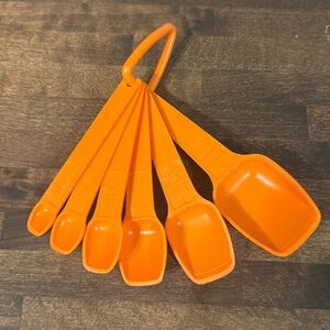 Vintage orange tupperware measuring spoons